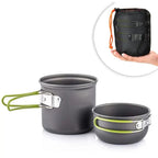Charcoal-grey camping pot and bowl with olive-green folding handles displayed side by side on white background