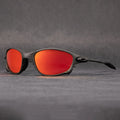 Sports sunglasses with red polarised lenses and aluminium-zinc frame on grey background