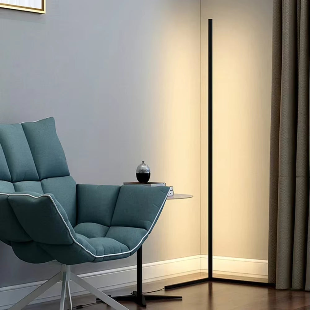 Corner LED floor lamp with remote control in modern living room setting showing warm ambient lighting