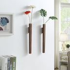 Walnut and beech wood wall vases set of 2 mounted on white wall holding flowers in lounge room setting
