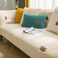 Teddy fleece sofa cover in off-white colour fitted on sectional lounge in bright living room