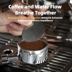 Stainless steel espresso puck screen held above portafilter basket filled with ground coffee, fine mesh detail visible