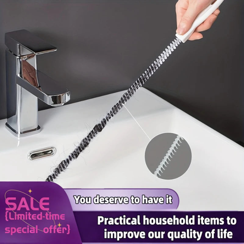 Flexible 45 cm drain cleaning brush with white handle removing hair clog from white bathroom basin drain