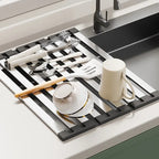 Over-sink drain rack stainless steel 304 positioned above modern kitchen sink with dishes