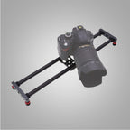 Camera slider rail carbon fibre black track with DSLR camera mounted on white background