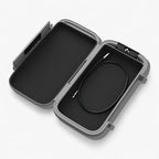 Grey portable safe box closed showing 4-digit combination lock and steel security cable on white background