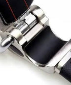 Close-up detail of metal alloy construction with leather padding on steering wheel lock
