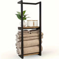 Single wall-mounted black metal towel rack with natural wood shelf on white background, rolled beige towels neatly stacked in lower section