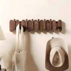 Wall coat rack walnut finish on white background showing hook design