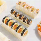 10-piece sushi mould kit at 45-degree angle showing round, square and heart-shaped moulds in off-white plastic