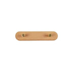 Beech wood wall coat rack with two brass knob hooks on a pure white studio background, front view