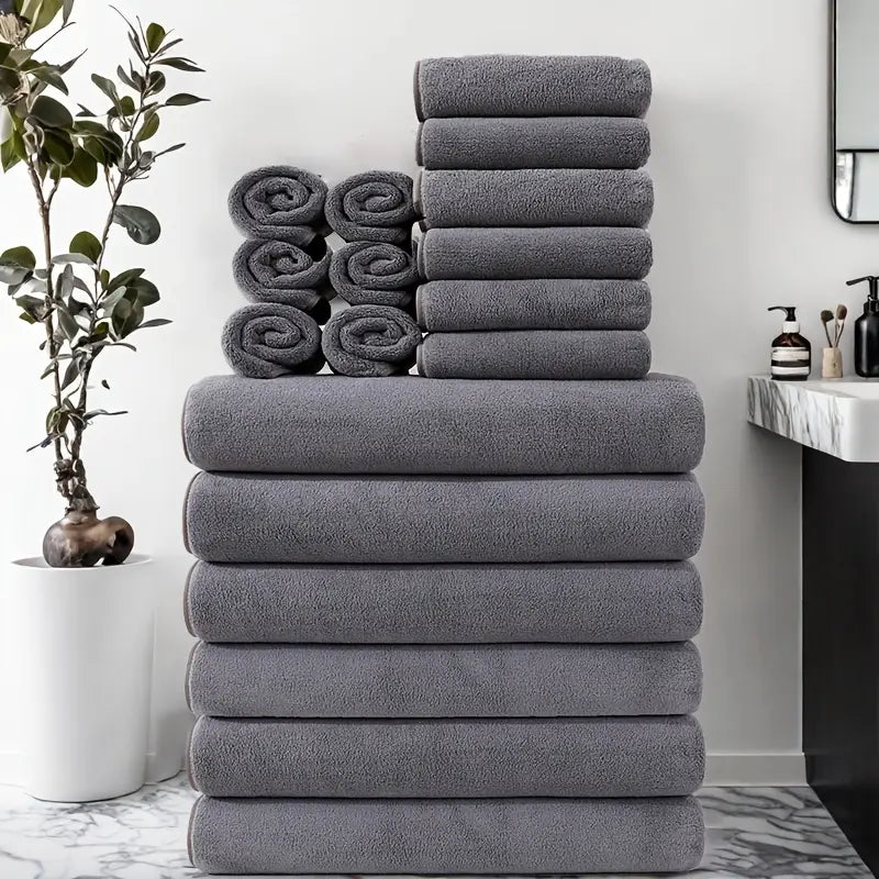 Full 18-piece blue towel set including bath towels hand towels and face washers on white background