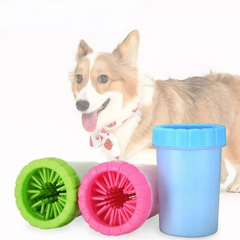 Three dog paw cleaner cups in green, pink, and blue showing soft interior silicone bristles, top view on white background