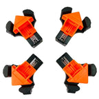 Four corner clamps set plastic construction orange black colour scheme on white studio background