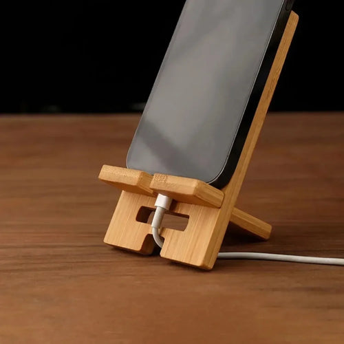 Single bamboo phone stand front view on white background showing stable base and panel design
