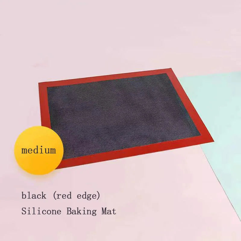 Black silicone non-stick mesh baking mat 30x40 cm with red edge on white background, flat lay product shot
