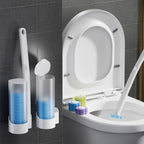 Disposable toilet brush system with handle and wall-mount caddy on white studio background