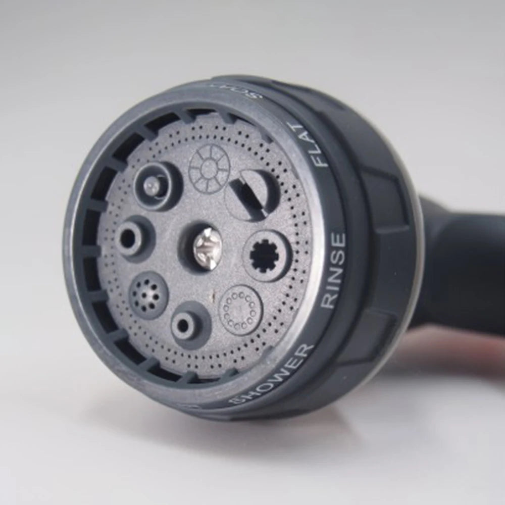 Garden spray gun nozzle head close up detail showing multiple spray pattern selection rings