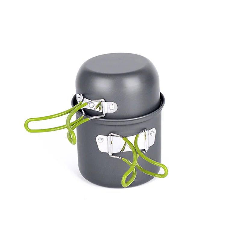 Hand holding a small mesh drawstring bag containing a nested 2-piece camping cookware set