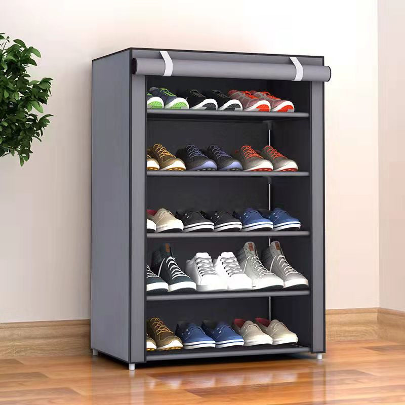 Grey fabric-covered freestanding shoe rack standing in tidy bedroom corner next to wardrobe