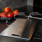 Hands using steel cutting board to chop fresh vegetables on smooth surface