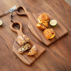 Walnut chopping board styled with cheese and charcuterie elegant serving presentation