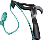 Red rope branch pruner in use with gardener pulling green rope to cut an overhead branch in the garden