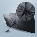 Car windscreen sun shade umbrella shown at 45-degree angle on white background, rib structure and centre handle visible