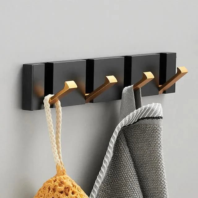 Black and gold 3-hook foldable wall rail in AU hallway linen jacket and canvas bag hanging on hooks