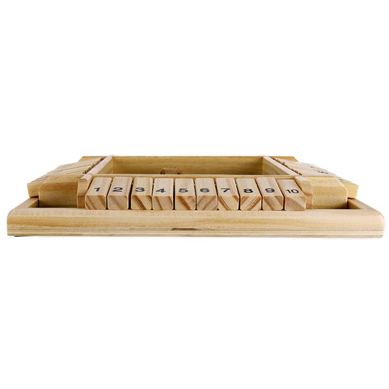 Family playing Shut the Box wooden board game at dining table in Australian home lounge room with natural daylight