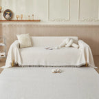Khaki sofa cover styled with decorative cushions in contemporary home setting