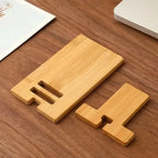Close-up of bamboo stand base with white charging cable threading through the open cable slot