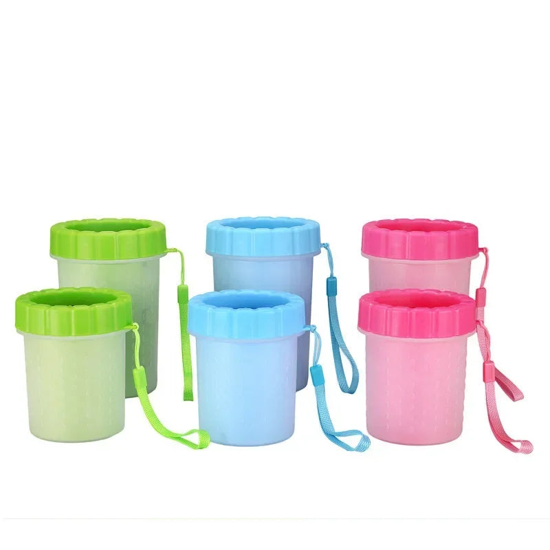 Dog paw cleaner cup in blue placed at back door with dog lead and doormat, styled home setting