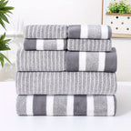 Close-up of microfibre towel stripe weave texture showing soft looped fabric in warm brown and white