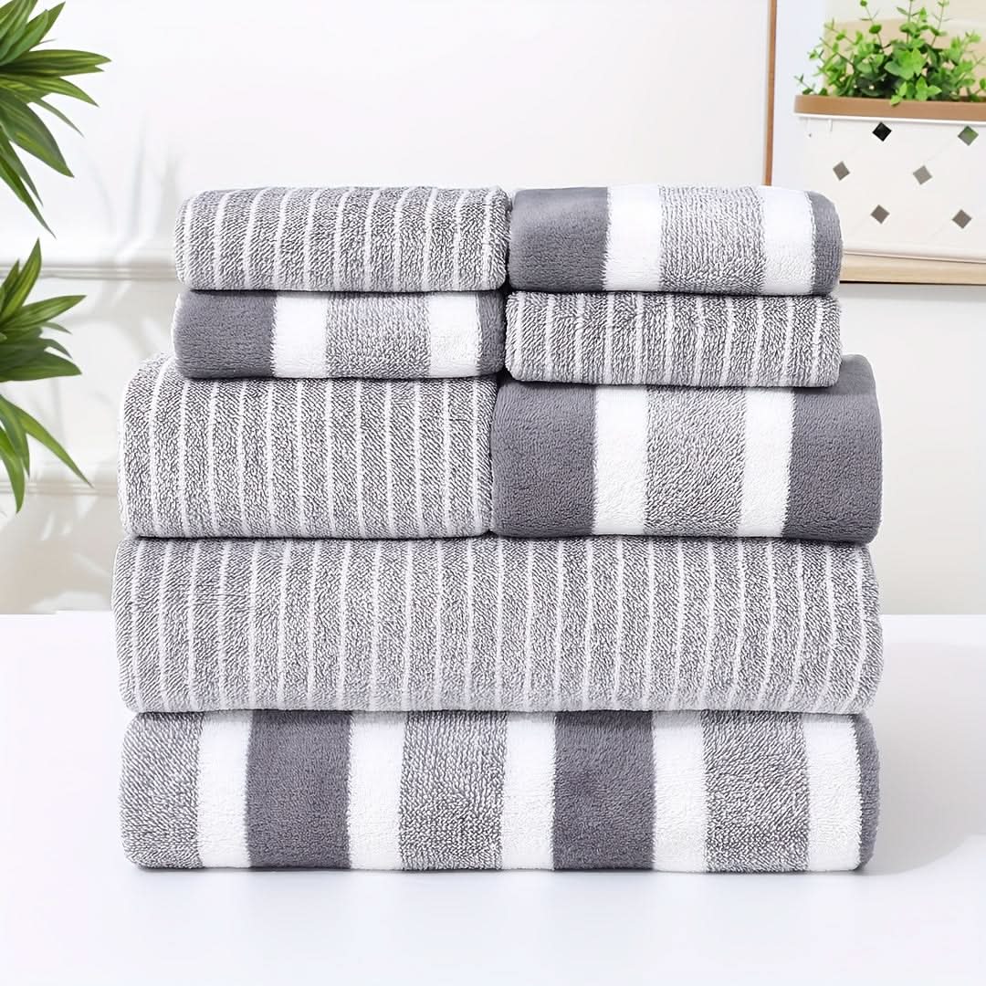 Close-up of microfibre towel stripe weave texture showing soft looped fabric in warm brown and white
