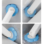 Disposable toilet brush in use cleaning inside toilet bowl flexible head under rim white bathroom