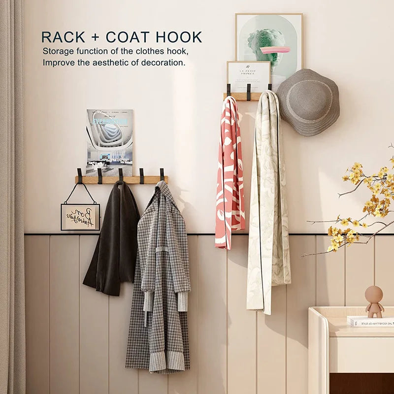 Detail view of moveable aluminium hooks sliding along wooden rail showing adjustable positioning feature