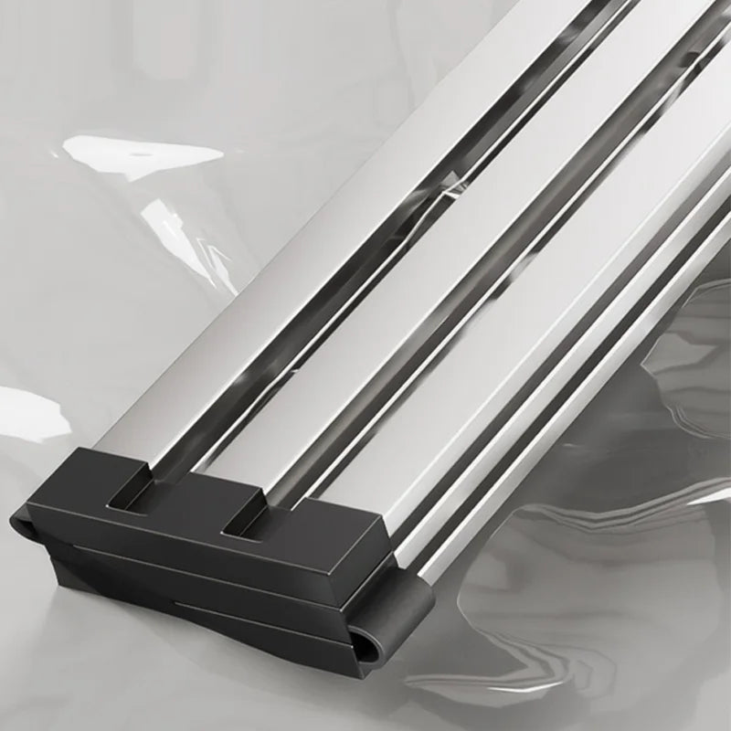 Close-up detail of non-slip rubber corner holders securing drain rack to kitchen sink edge