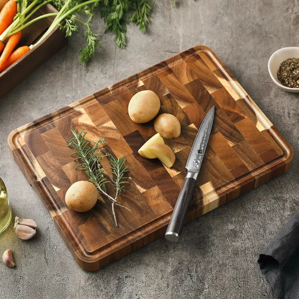 Close-up detail of acacia wood cutting board showing smooth grain texture and burr-free edges