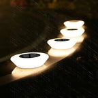 Solar LED path lights wooden deck walkway installation waterproof outdoor evening ambiance