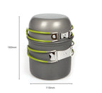 Close-up of anodised camping pot interior and stainless steel folding handle bracket with green silicone grip