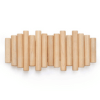 Close-up of wooden wall coat rack showing staggered cylindrical rod detail and smooth natural wood grain finish on individual rods