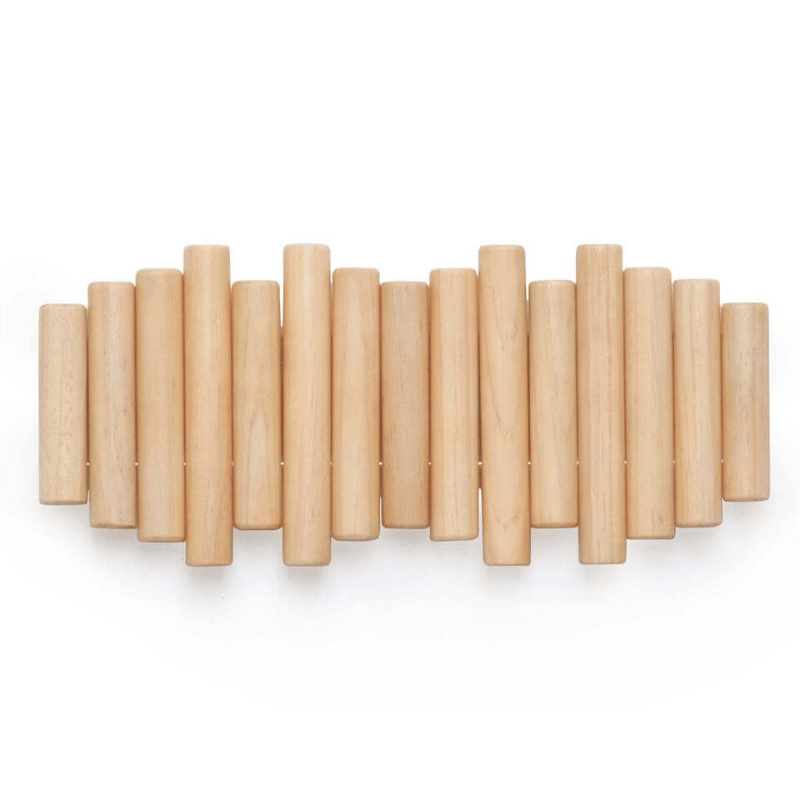 Close-up of wooden wall coat rack showing staggered cylindrical rod detail and smooth natural wood grain finish on individual rods