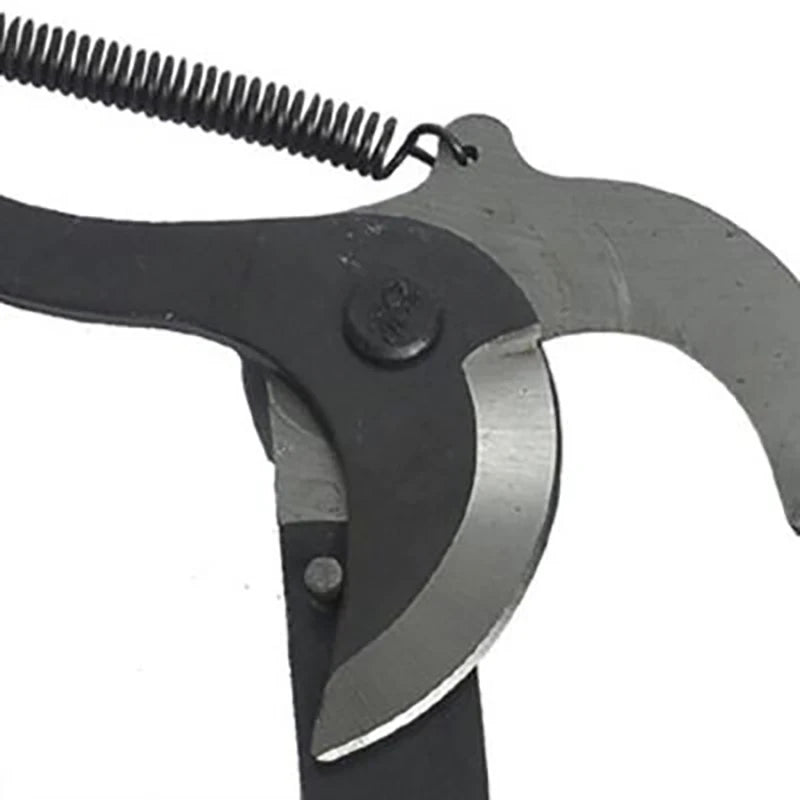 Single black branch pruner flat lay on garden bench with green pull rope coiled neatly beside tool