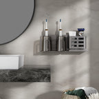 Family bathroom with wall-mounted aluminium organiser holding toothbrushes razors and tubes