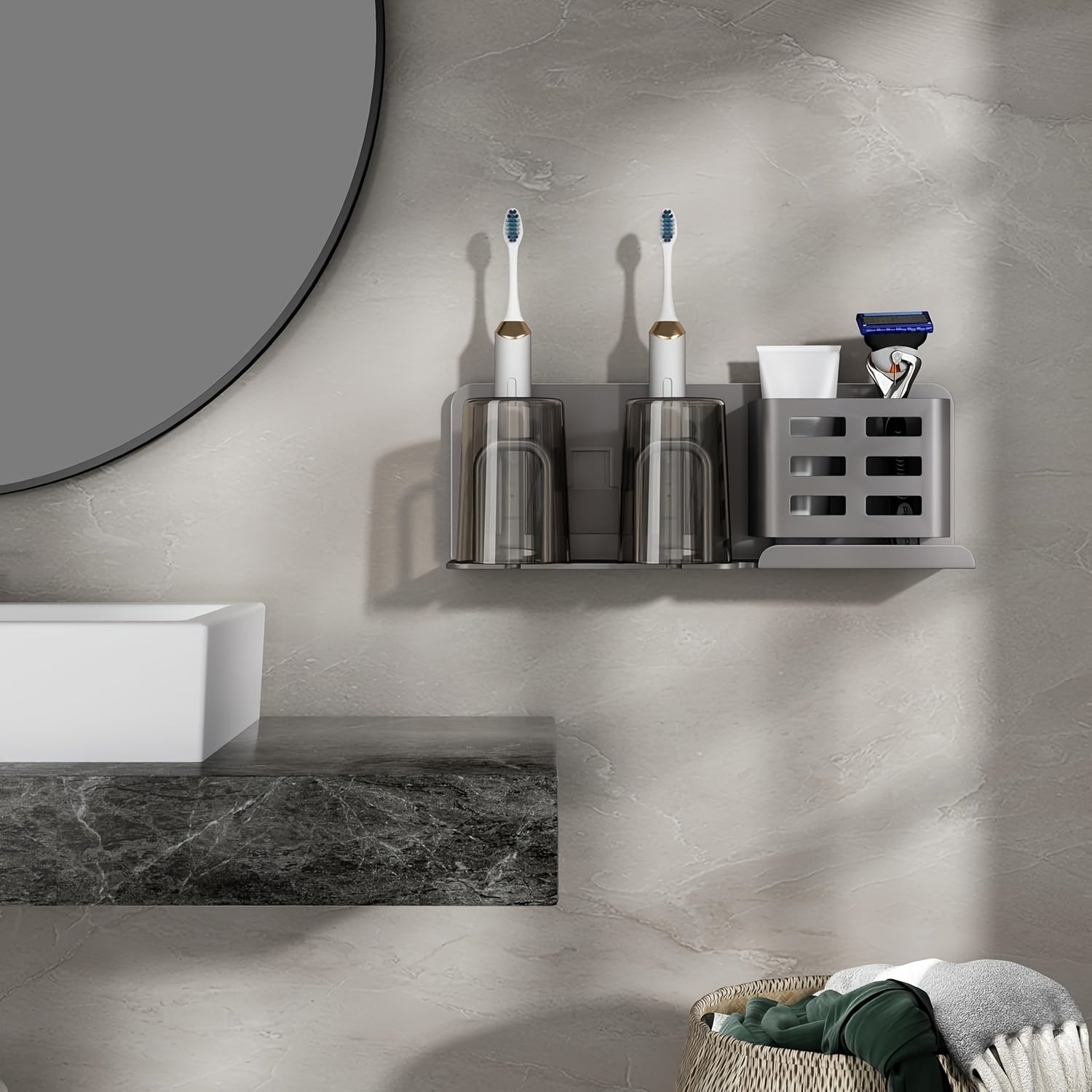Family bathroom with wall-mounted aluminium organiser holding toothbrushes razors and tubes