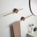 Full bathroom wall with two staggered walnut wood towel bars, round mirror, and minimal accessories in neutral tones