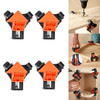 Corner clamps holding wooden picture frame pieces during assembly showing precise right angles