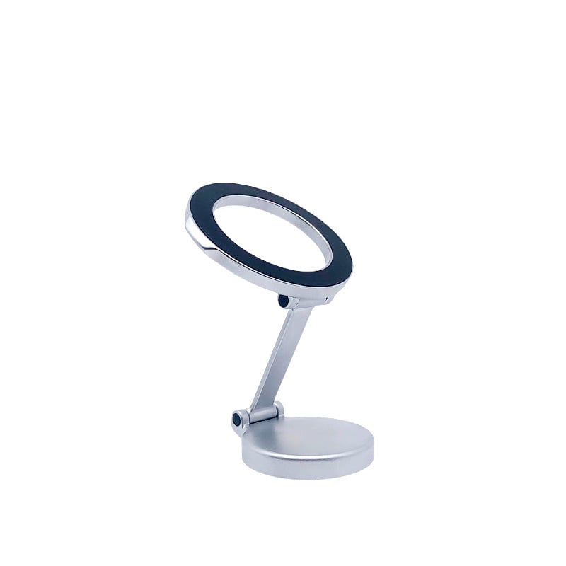 Magnetic car phone holder attached to air vent clip in modern car interior, daytime lighting