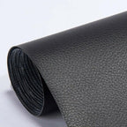 Close-up of beige-white leather repair patch surface showing material grain texture and finish quality
